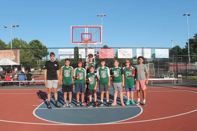 a group of people posing for a photo on a track