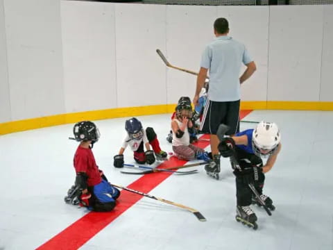 a group of kids playing hockey