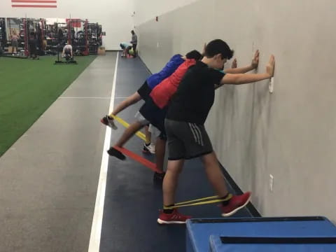 a couple of boys playing a sport