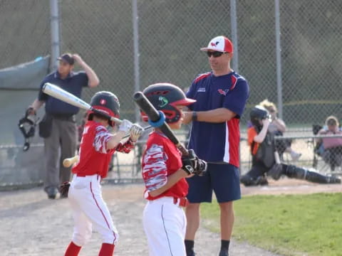 a group of kids playing baseball