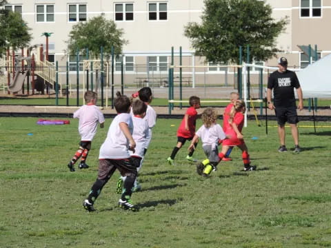 a group of kids playing football