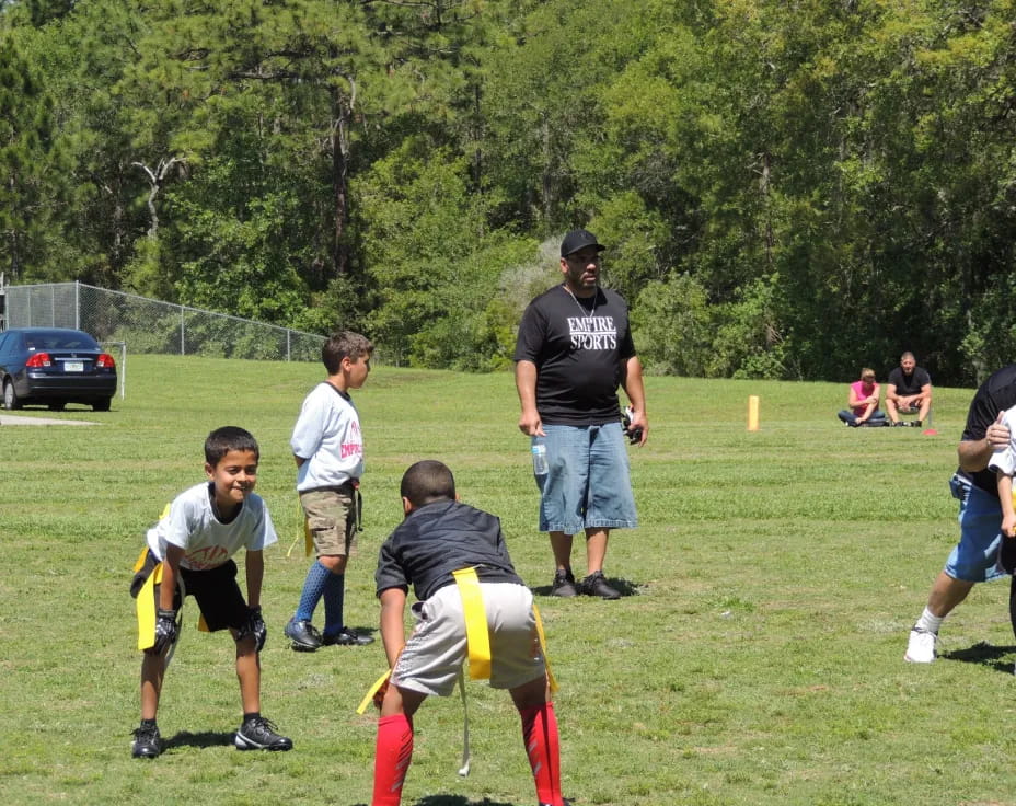 a group of people playing football