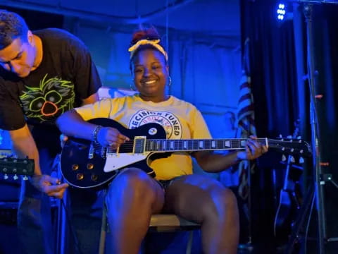 a man playing a guitar