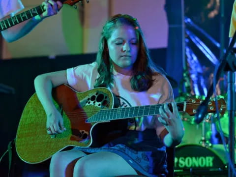 a person playing a guitar