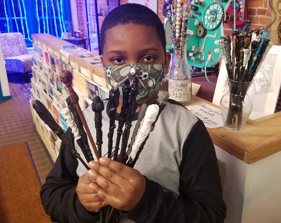 a man holding a paintbrush