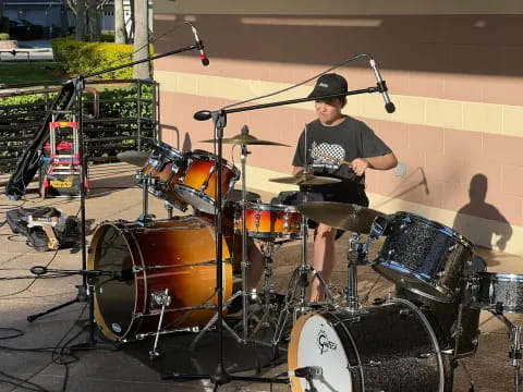 a person playing a drum set