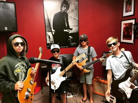 a group of people holding guitars