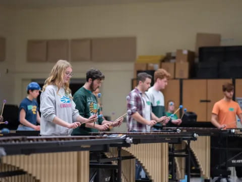 a group of people playing a piano