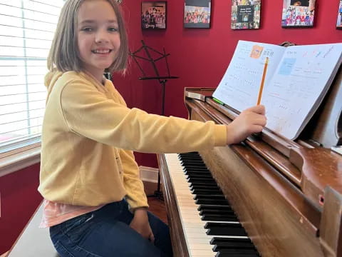 a girl playing a piano