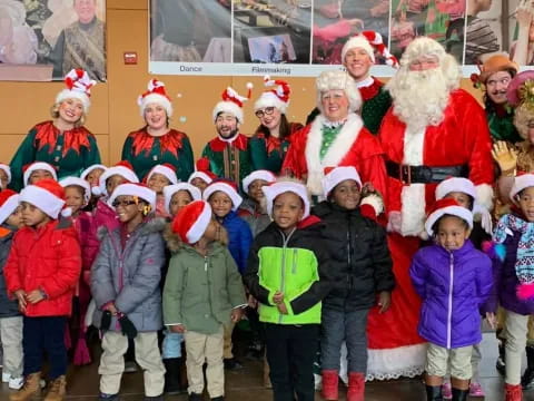 a group of children in santa hats