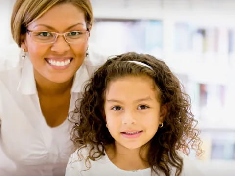 a woman and a child smiling