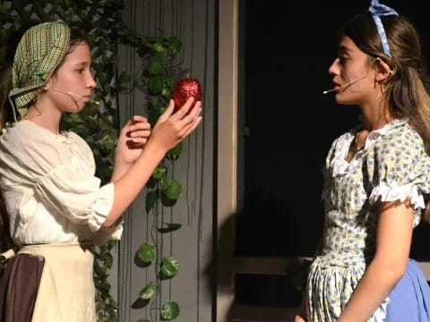 a person holding a strawberry
