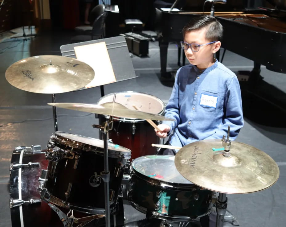 a boy playing drums