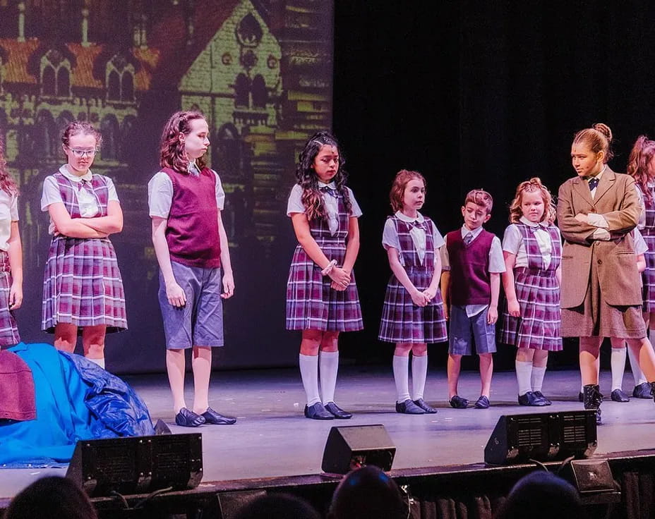 a group of children on a stage