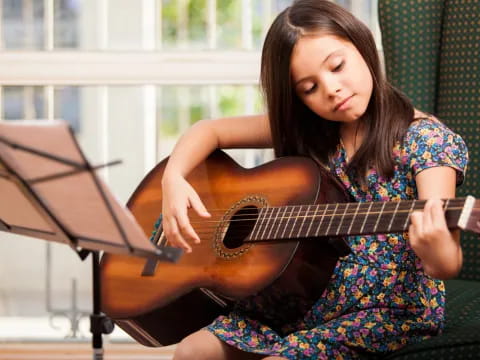 a woman playing a guitar