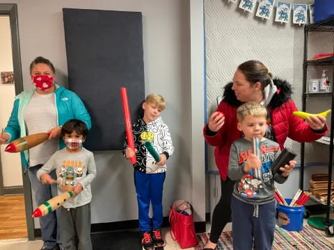 a group of kids wearing masks