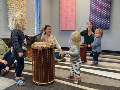 a group of people playing drums