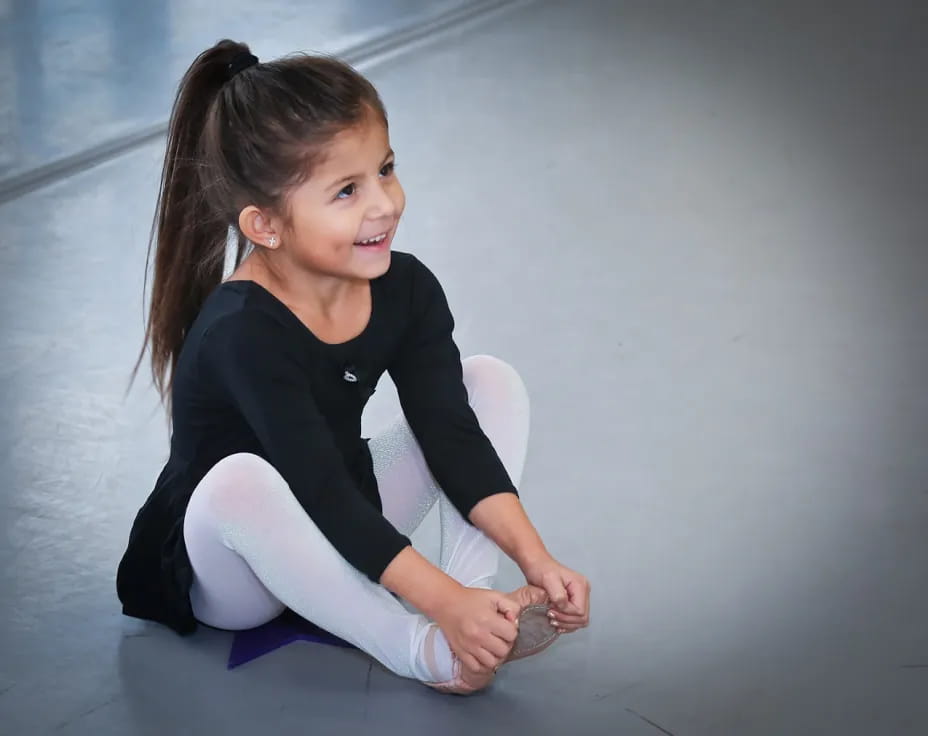 a girl sitting on the floor