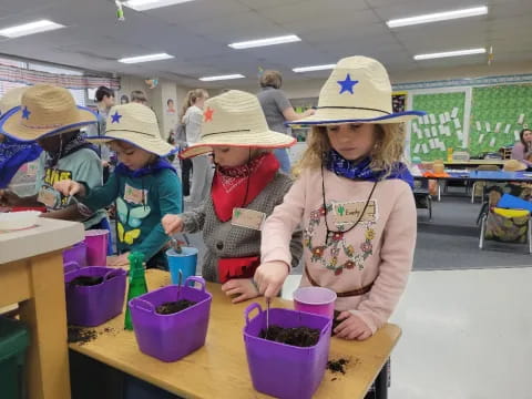 a group of children wearing hats