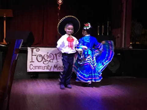 a boy and girl in clothing