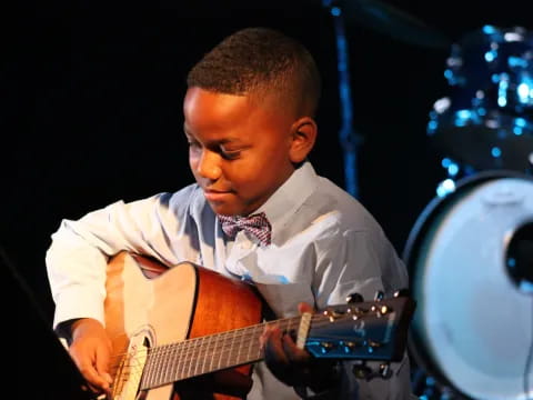 a man playing a guitar