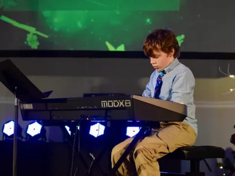 a man sitting at a piano