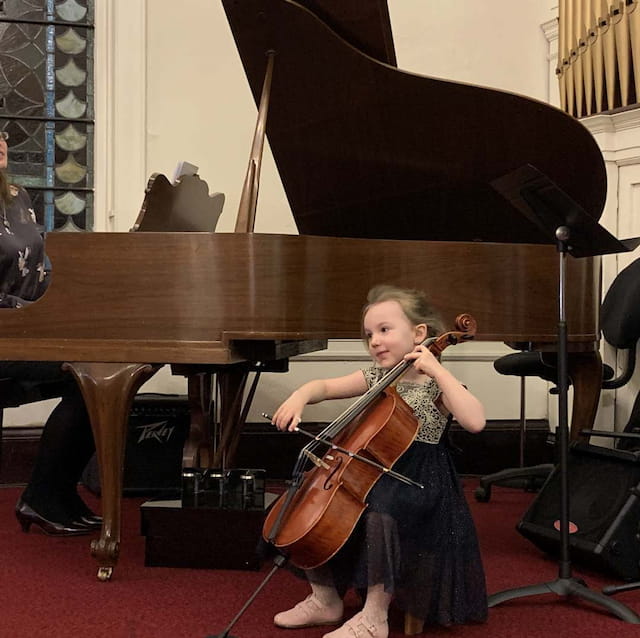 a girl playing a violin