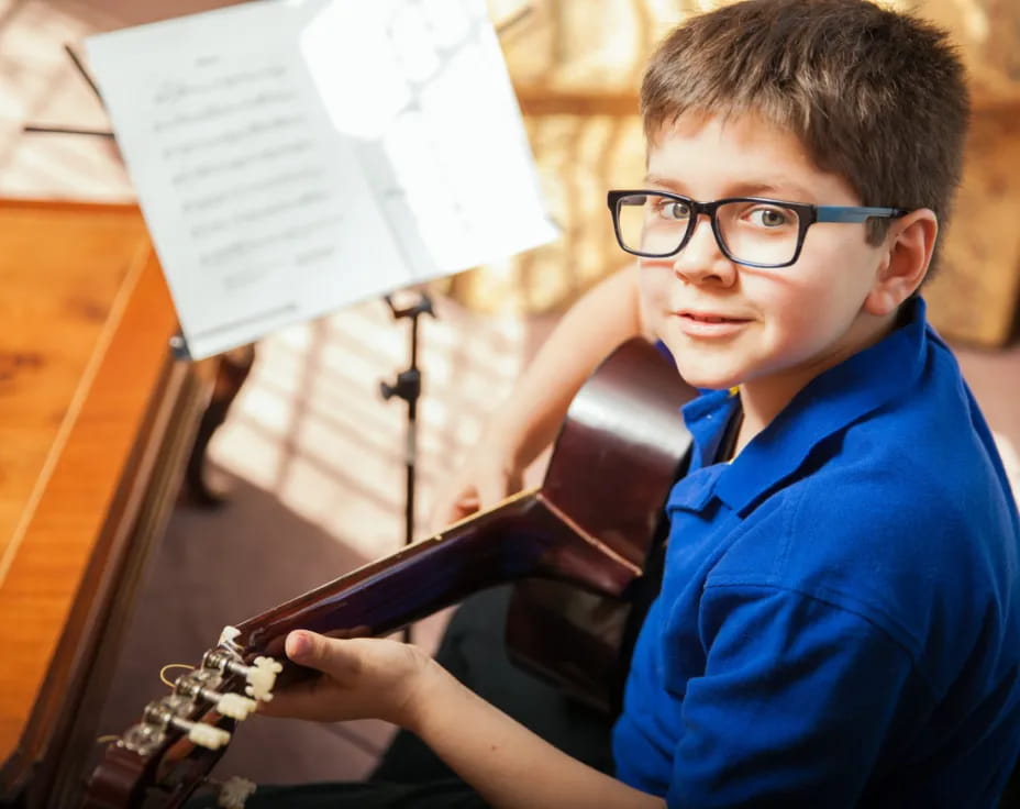a boy playing a violin