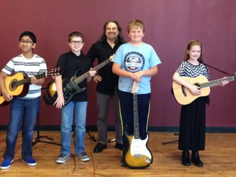 a group of people holding guitars
