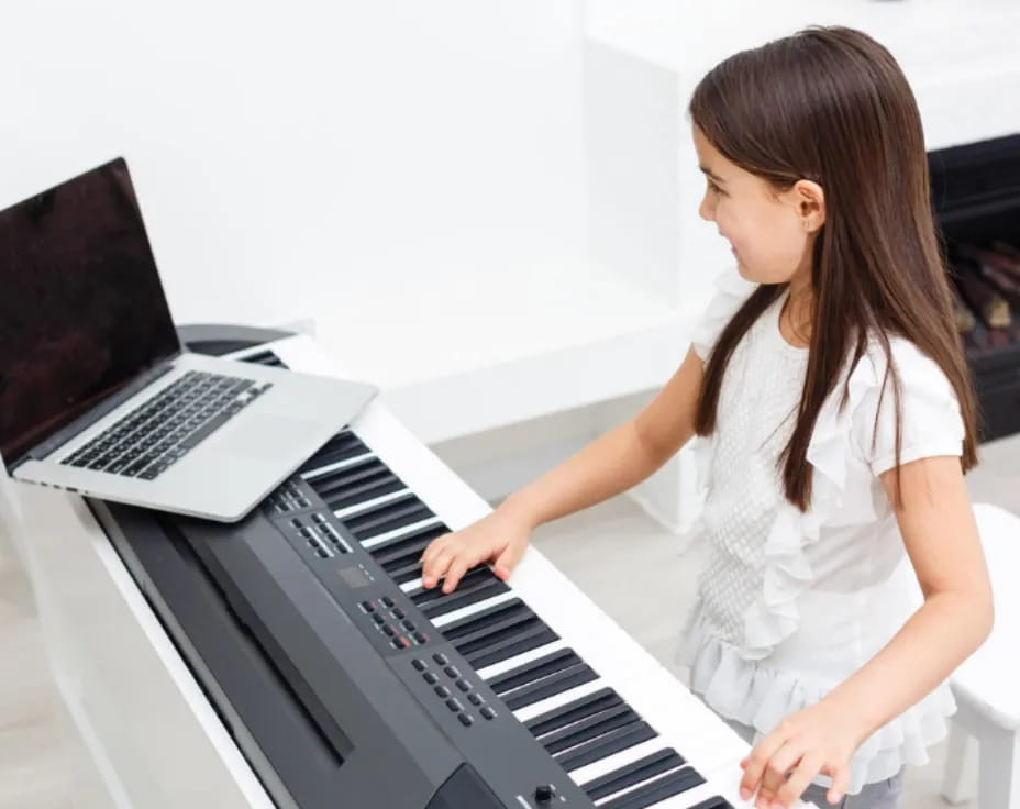 a woman playing a piano