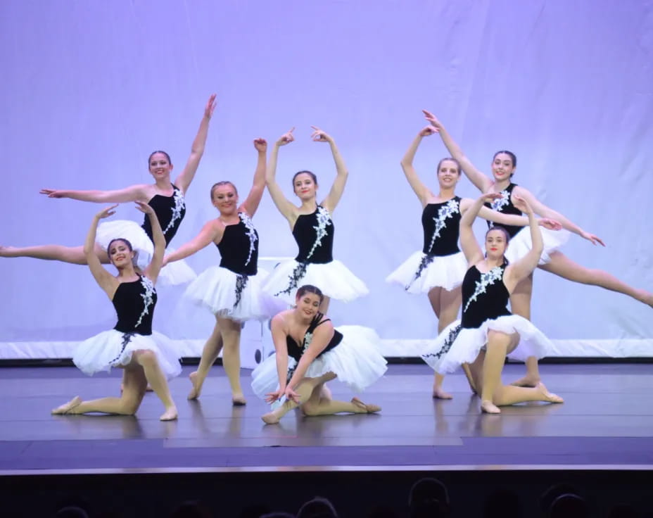 a group of women dancing on a stage