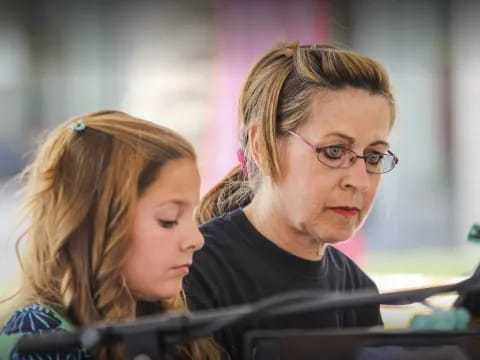 a woman speaking to a man