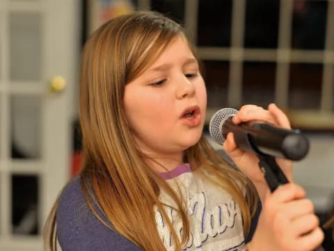 a person holding a microphone