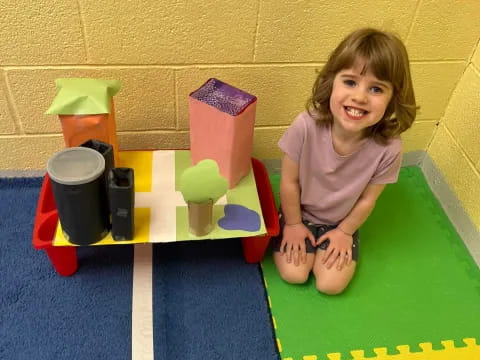 a child sitting on a mat
