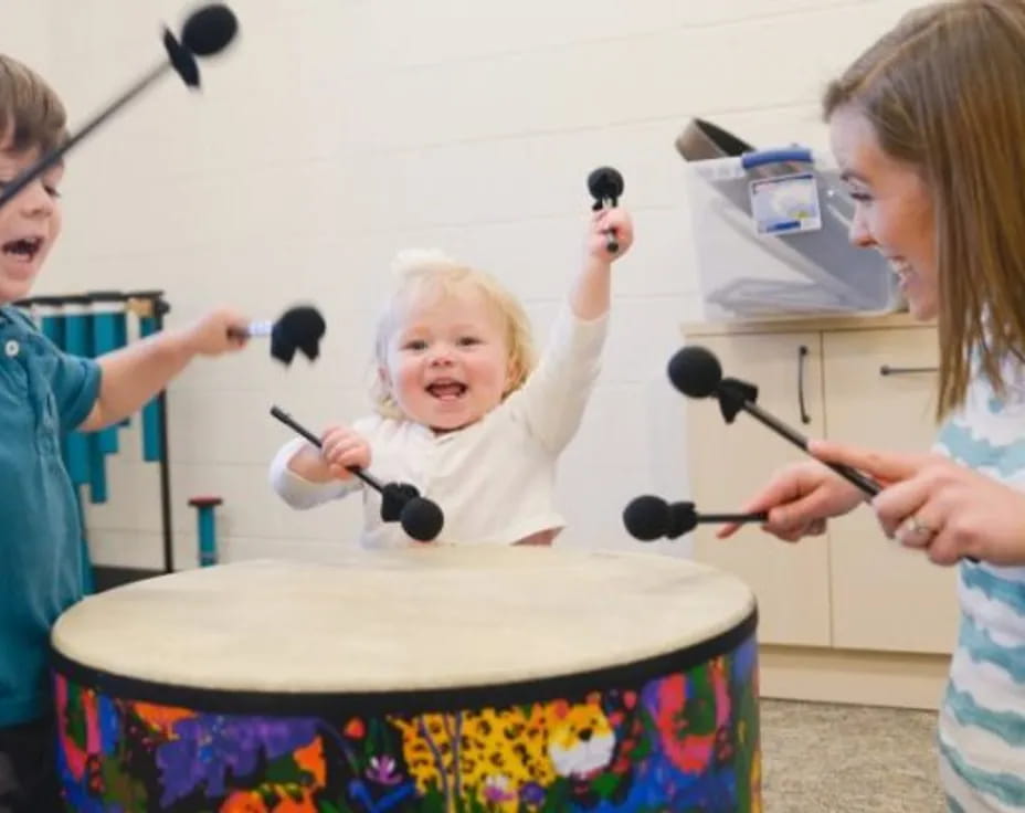 a group of kids playing with a toy