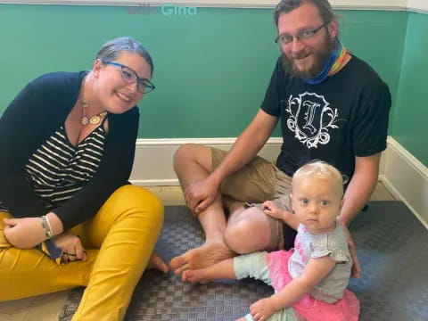 a man and woman with two babies