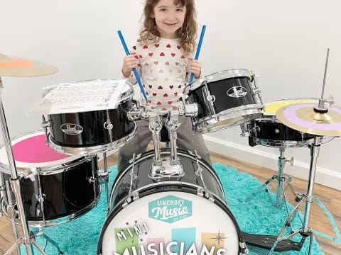 a girl playing drums