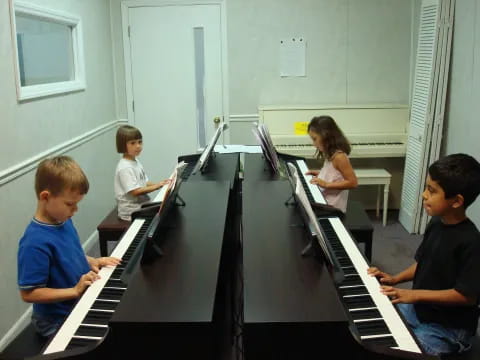 a group of kids playing piano