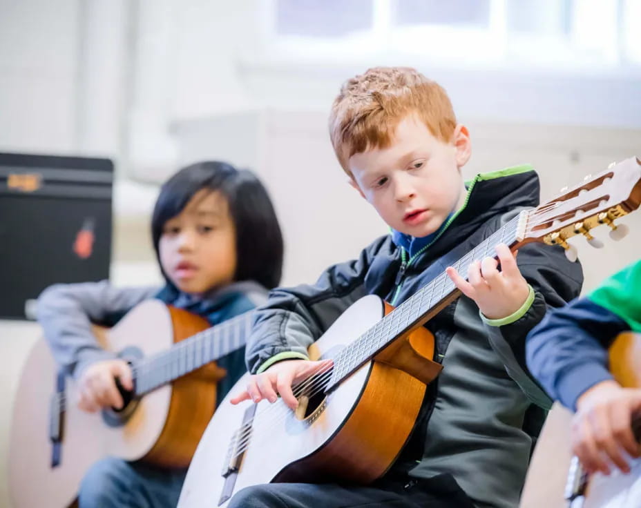 a group of kids playing instruments