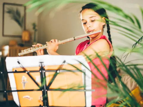 a girl playing a violin