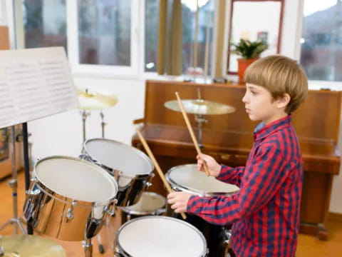 a boy playing drums