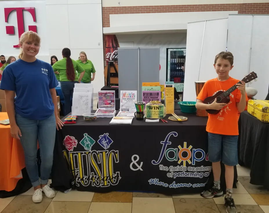 a couple of boys holding guitars