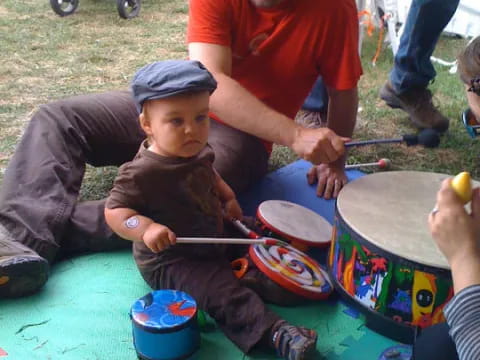 a person and a child painting