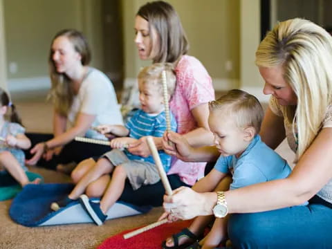 a person helping a child with a toy