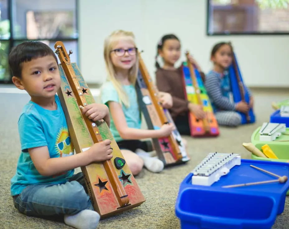 a group of kids playing instruments
