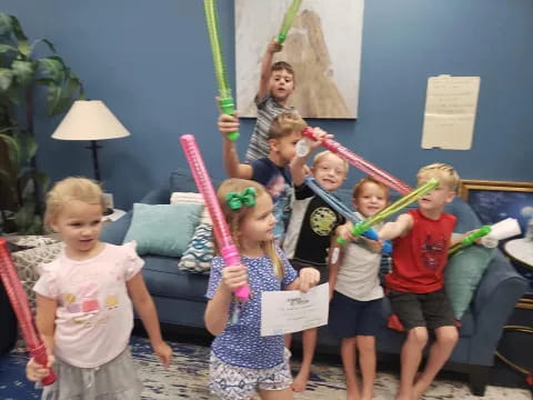 a group of children holding up a sign