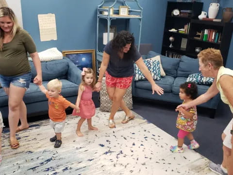 a group of people playing with kids