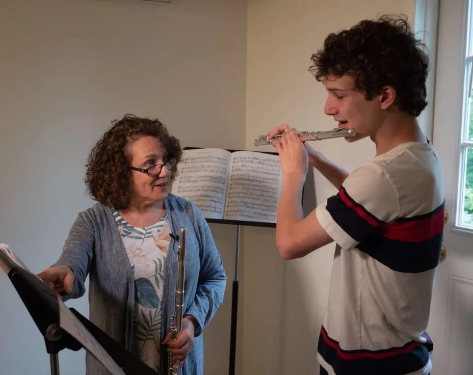 a man brushing another man's teeth