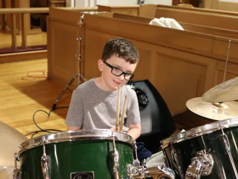 a boy playing drums