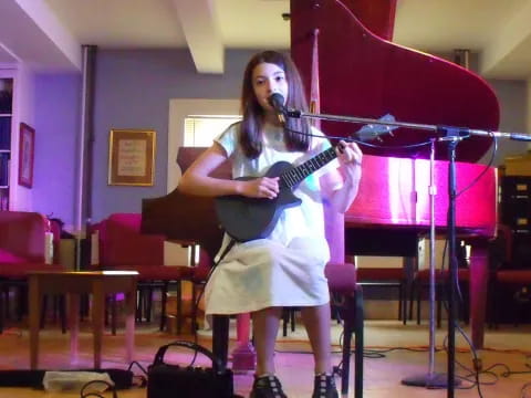 a woman playing a guitar